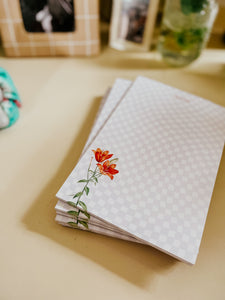 Lilies on a Notepad